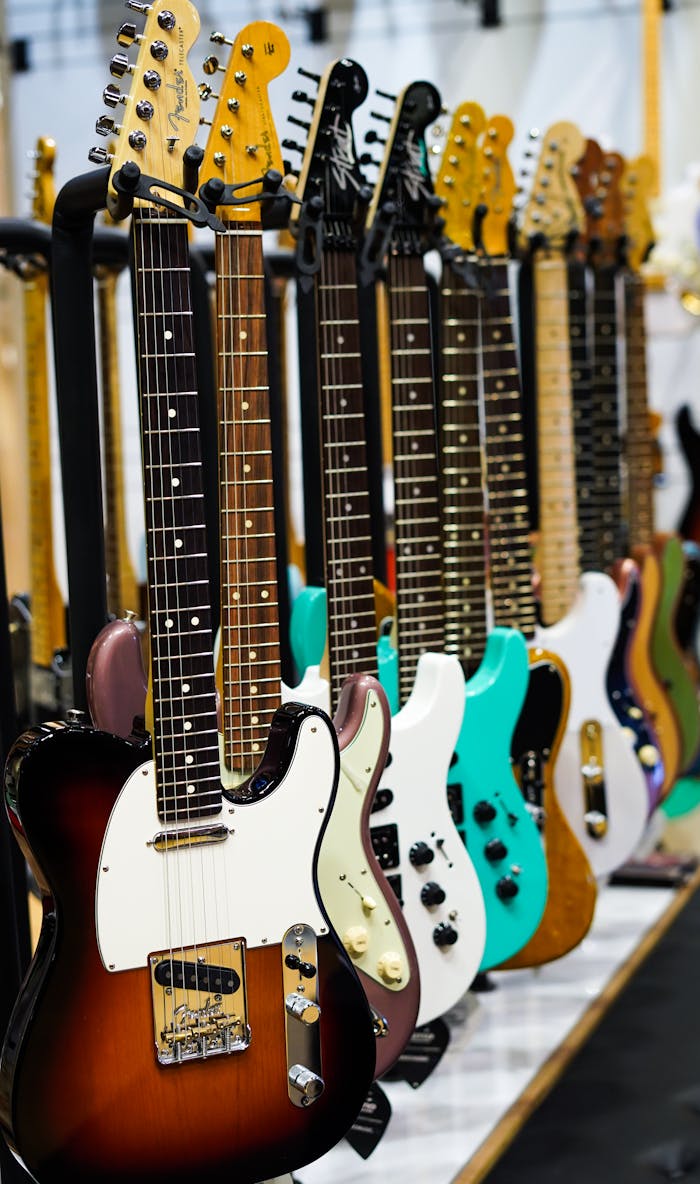 A vibrant row of electric guitars showcased in a music store setting.